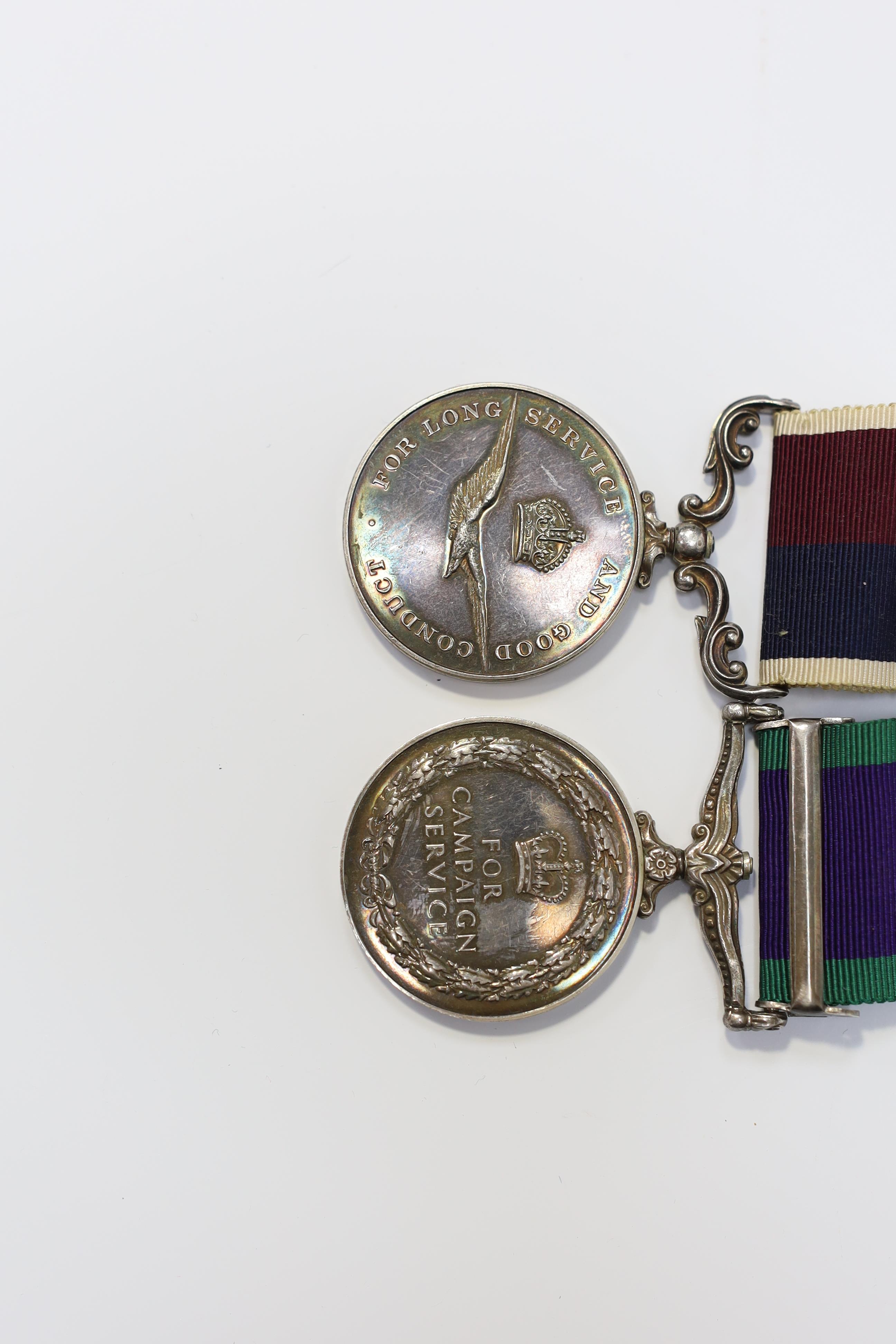 An ERII RAF medal pair awarded to Cpl. A.F.G. Pitcher RAF, comprising; a General Service Medal with a bar for Borneo and an RAF Long Service Medal, mounted on a common pin. Condition - fair to good